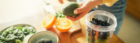 Ingredients for a green smoothie are being prepared