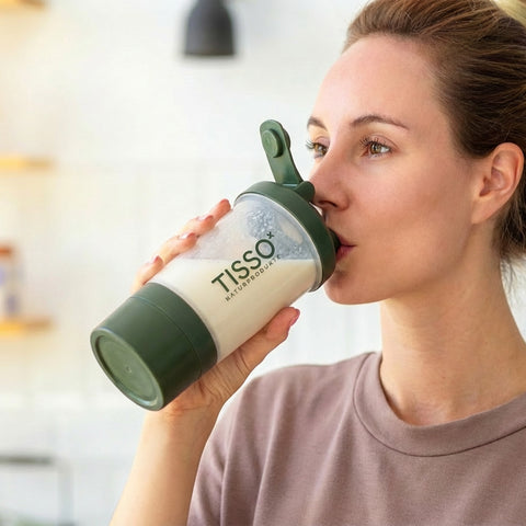 A woman is drinking from a TISSO Shaker; Image note: AI-assisted content