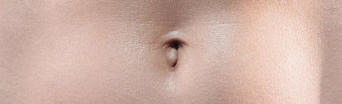 Close-up of a belly button – symbolic image representing gut health